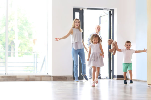 Happy family entering new house